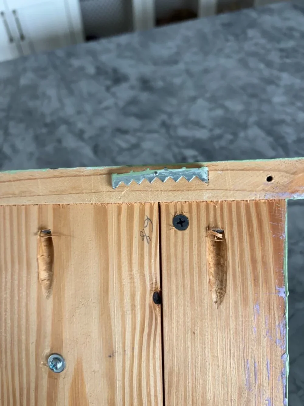 Light green, handmade wooden wall shelf with hanging star knobs for hanging